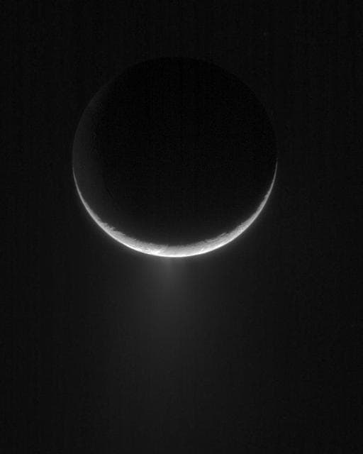 Water-ice plumes erupting from the south pole of Saturn's moon Enceladus, captured by Cassini