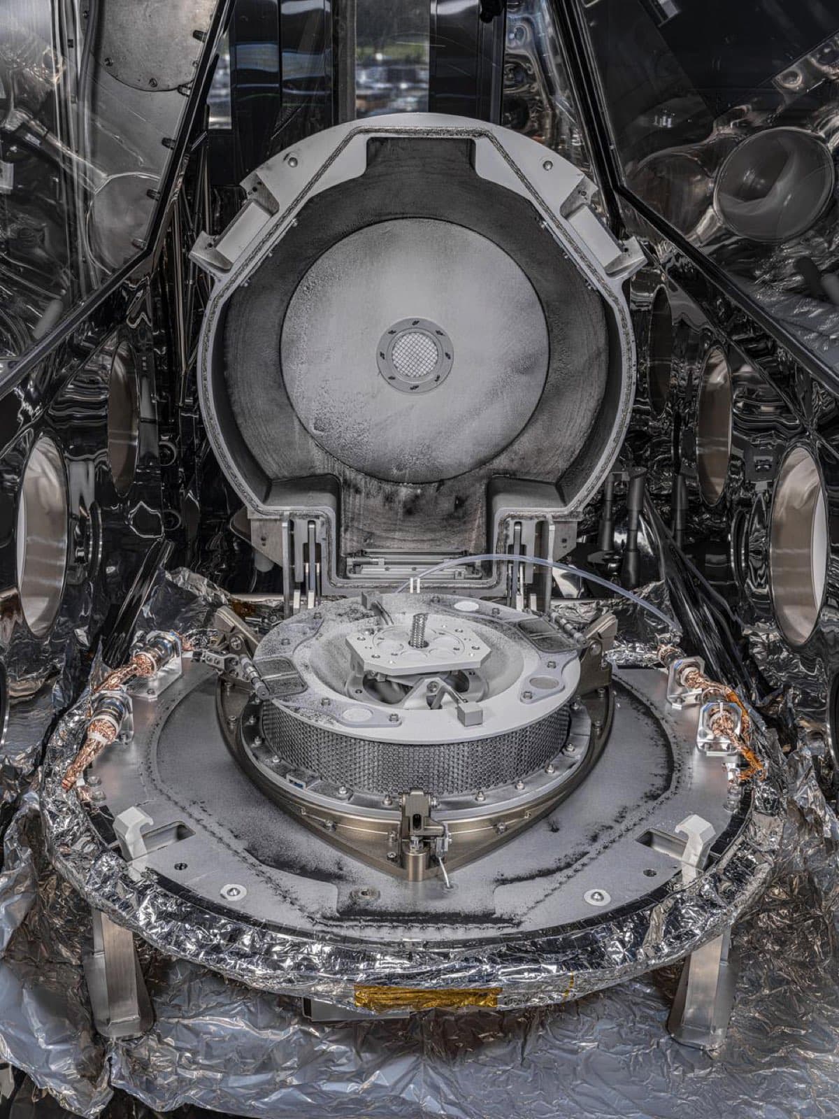 The OSIRIS-REx sample return capsule opened to reveal dark material from asteroid Bennu