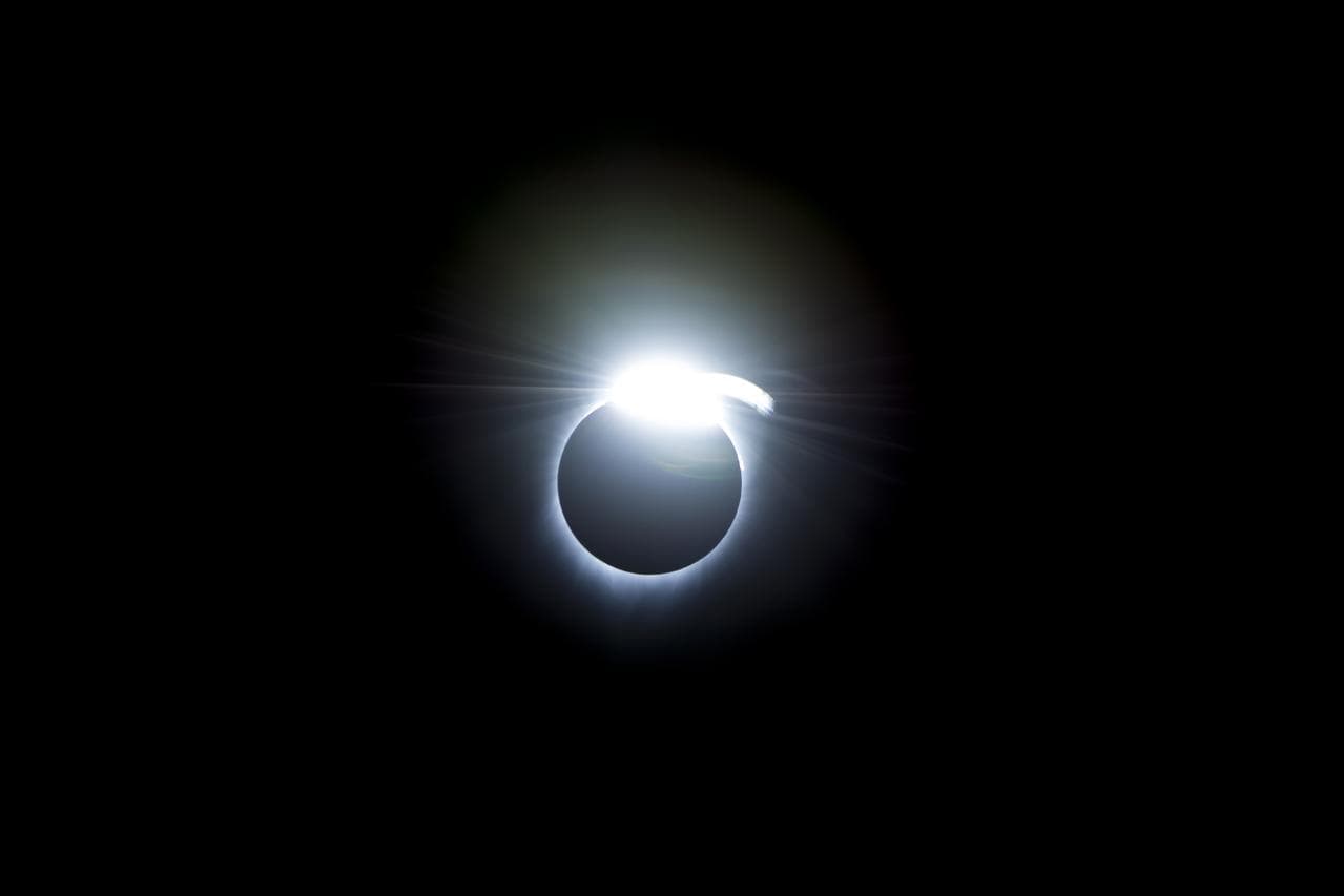 Total solar eclipse showing the Sun's corona surrounding the dark disk of the Moon