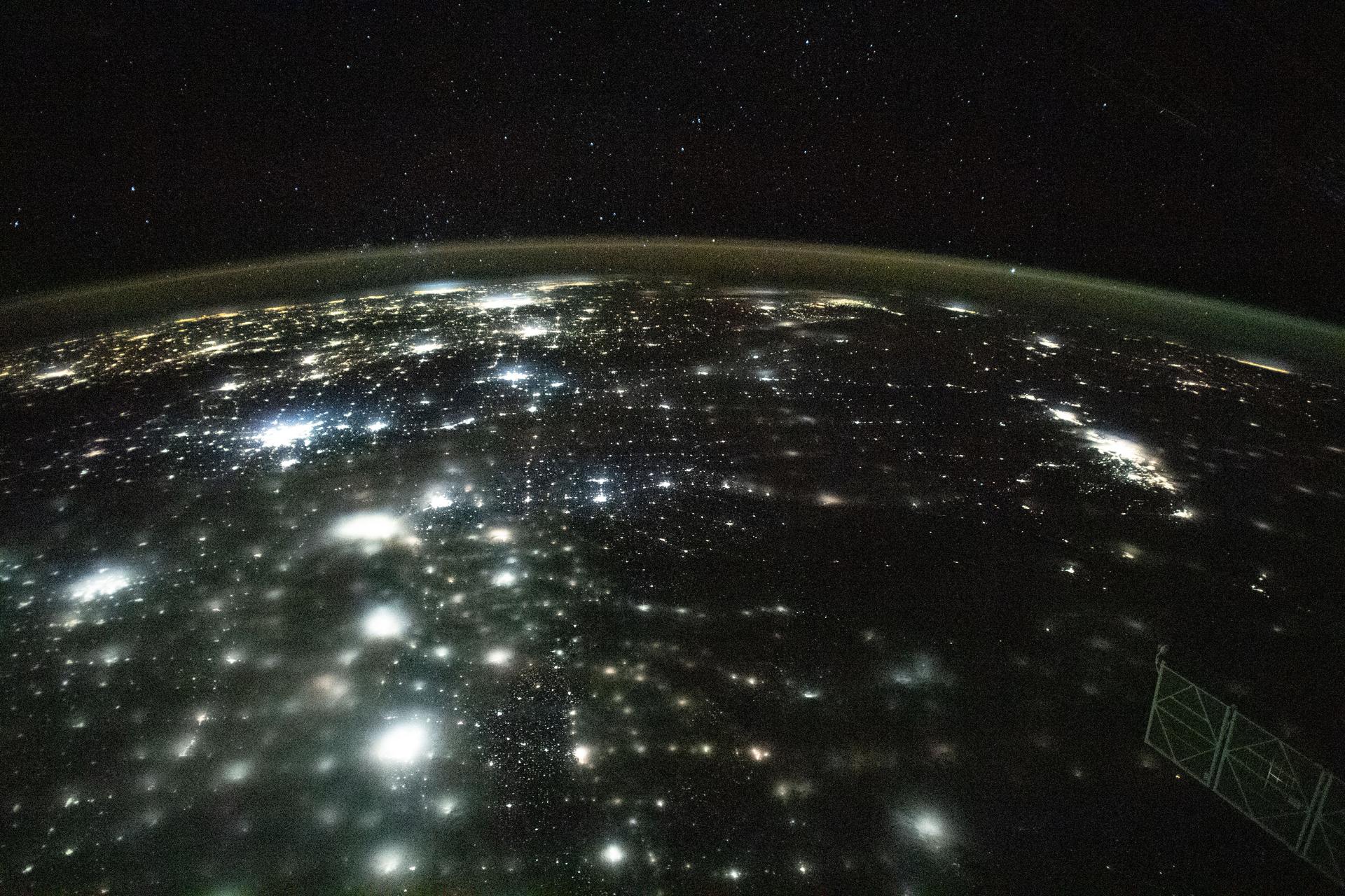 Earth's city lights as seen from the International Space Station, illustrating the massive energy demands of modern civilization