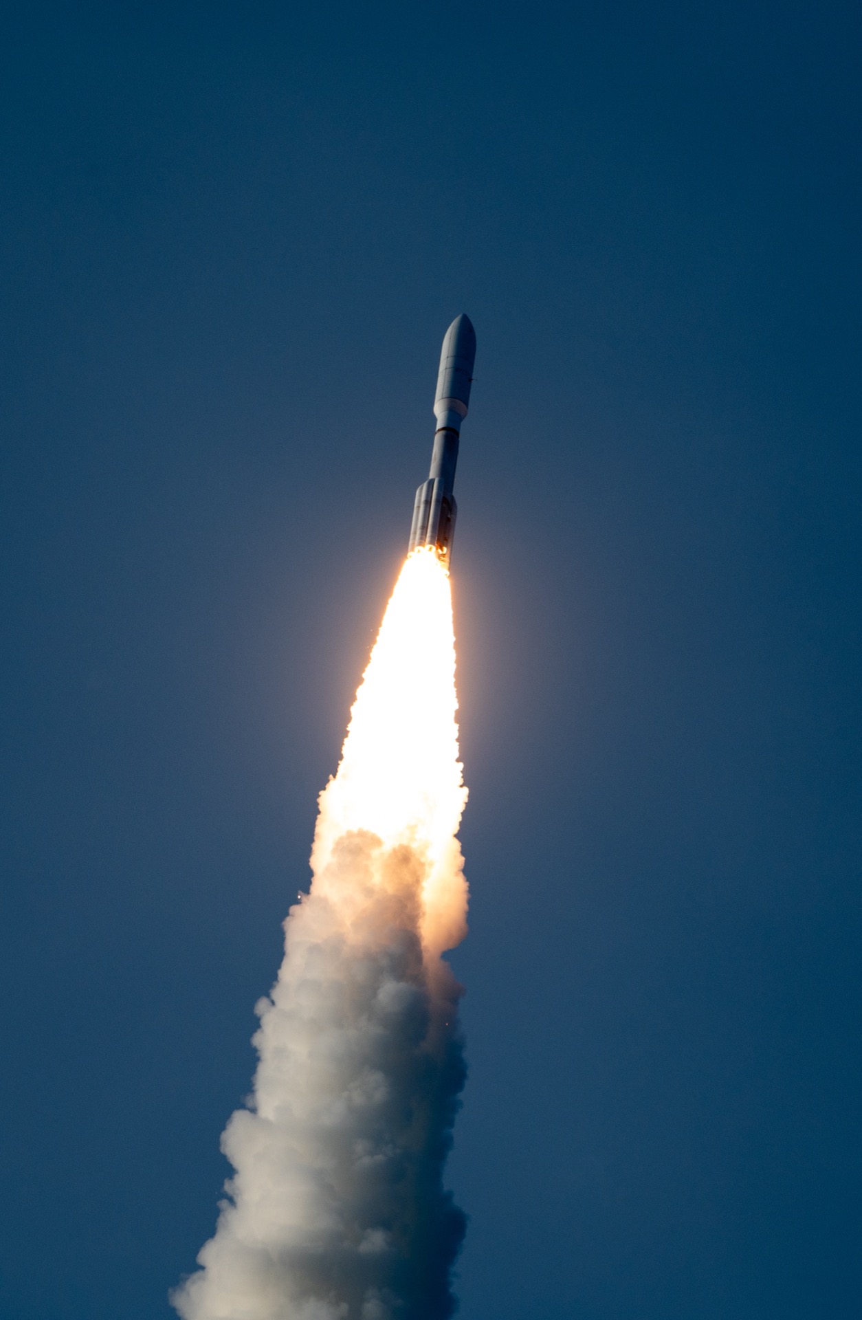 An Atlas V rocket on the tower at Cape Canaveral being prepared for an Amazon Leo deployment mission — Amazon's multi-provider launch strategy is unique among D2D operators